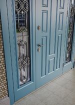 Декоративная ковка 249к-3, установленная на уличную дверь